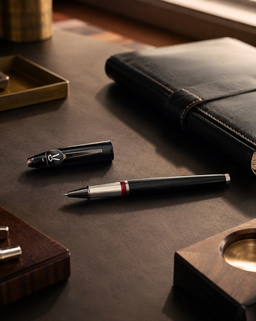 Prime Lawyers pen on a leather desk with notebook and brass tray